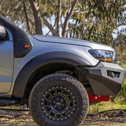 Off-road vehicle with large tires and rugged design in a natural setting