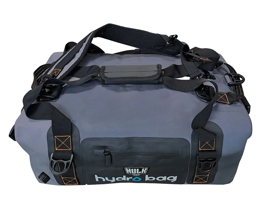 Gray duffel bag with black straps on a white background